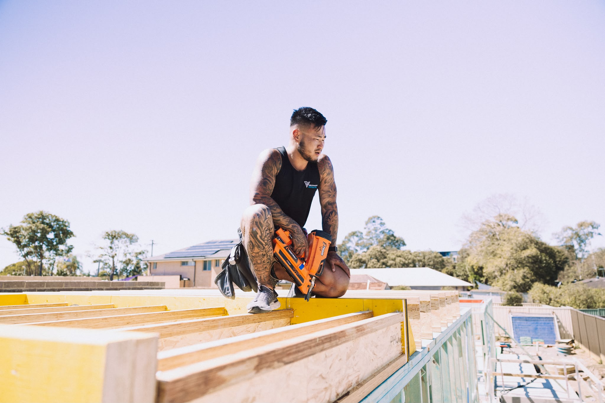 Carpenter working on a timber frame with a circular saw